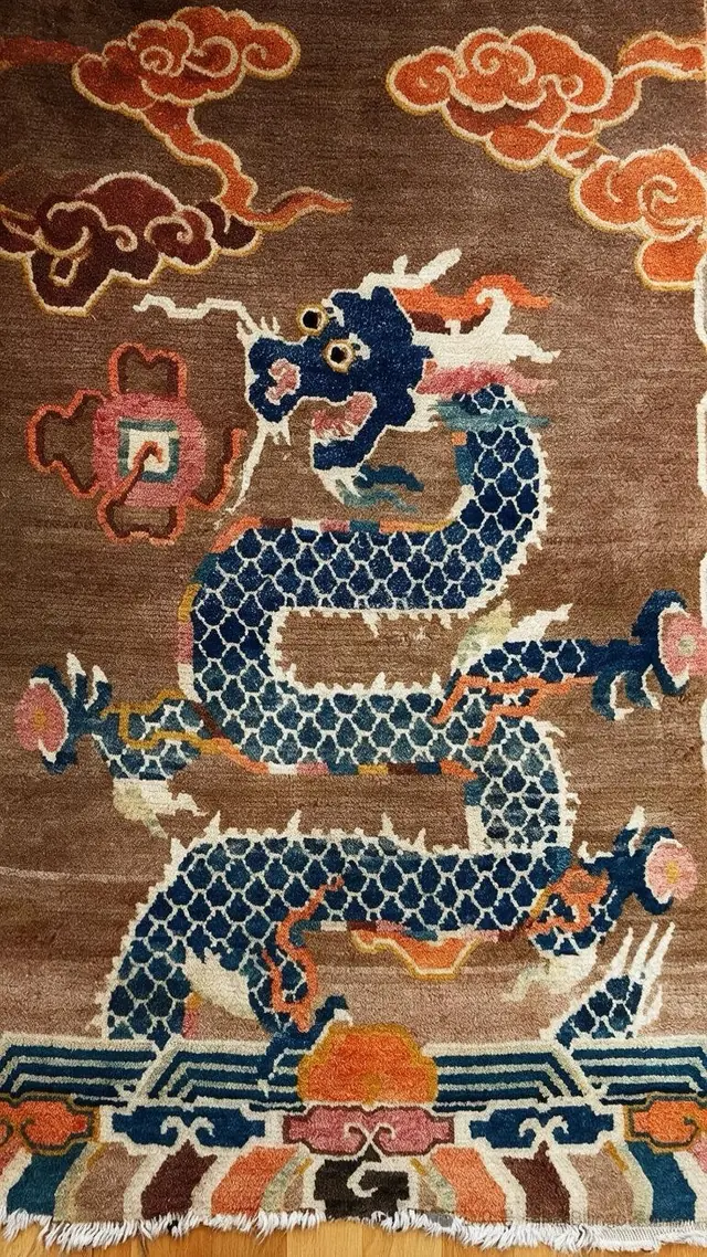 Handcrafted Tan wool rug featuring a traditional dragon motif