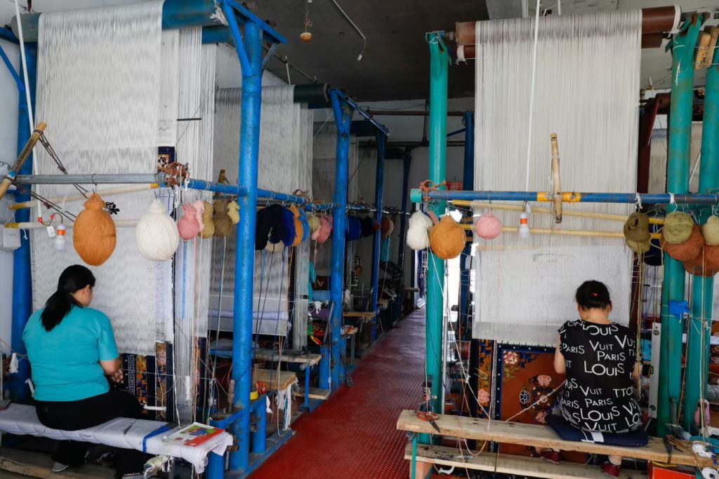 Textile loom production team